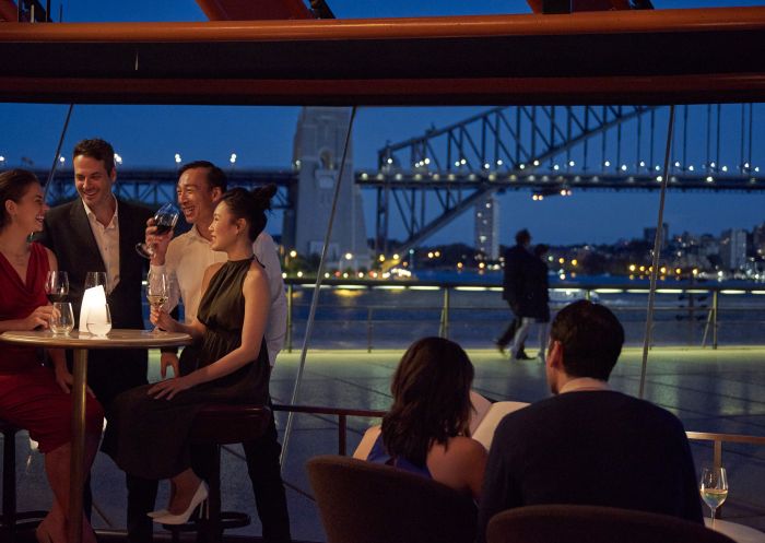 Bennelong Restaurant, Sydney Opera House Couple enjoying an evening out with friends at Bennelong Restaurant, Sydney Opera House