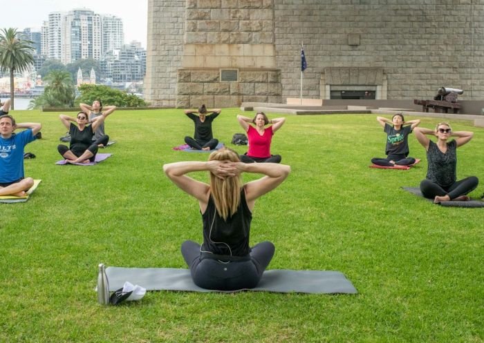 Yoga Under the Bridge, Dawes Point - Credit: Yoga Under the Bridge Group of people enjoying yoga class with Yoga Under the Bridge, Dawes Point